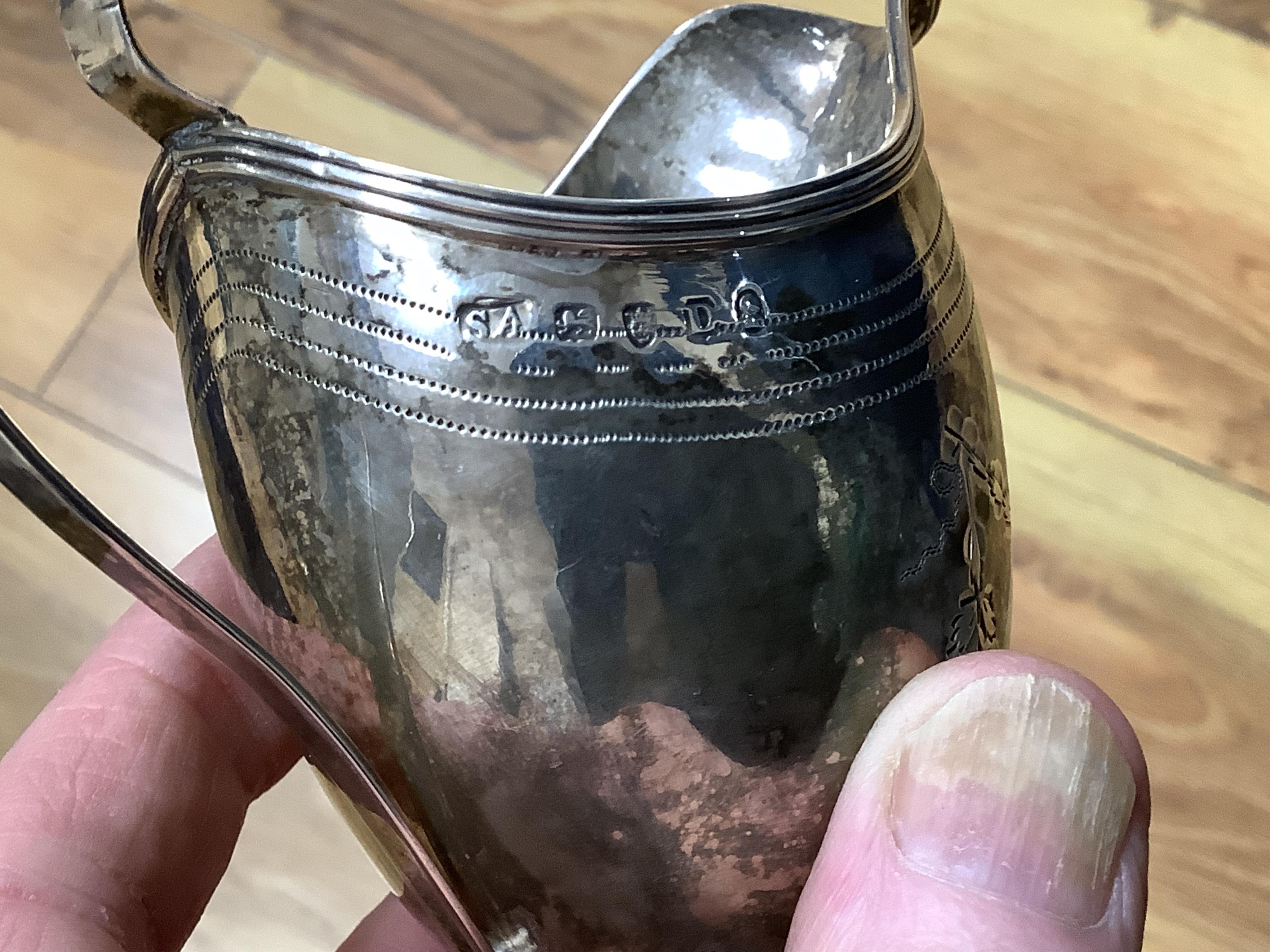 A George III silver helmet shaped cream jug, by Stephen Adams II, London, 1799, 12.8cm, 87 grams.